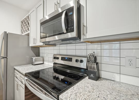 a kitchen with a stove and a microwave