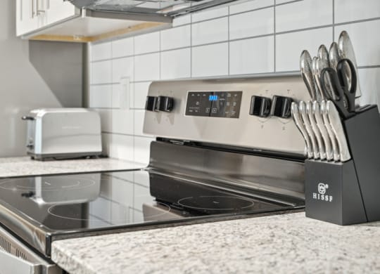 a kitchen with a stove and a counter top