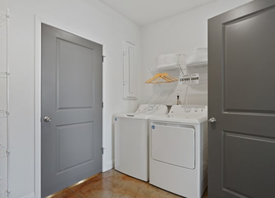 a small laundry room with a washer and dryer