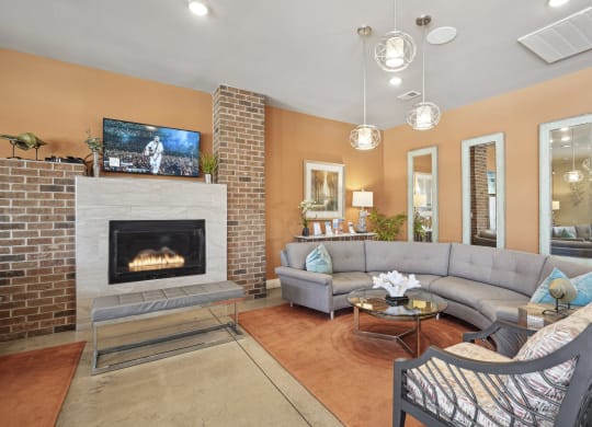 a living room with couches and a fireplace