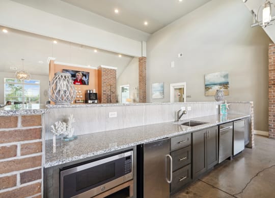 a kitchen with stainless steel appliances and granite counter tops