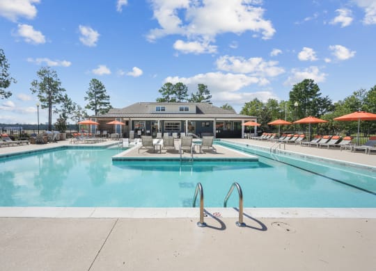 the swimming pool at the falls at rolland park apartments