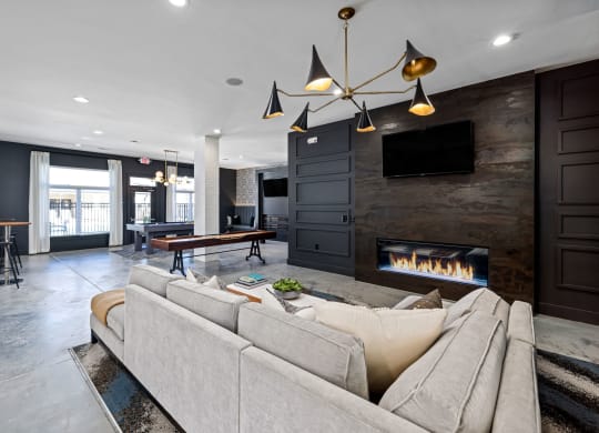 interior resident lounge with a couch and a fireplace
