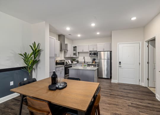 a kitchen and dining room with a table and chairs