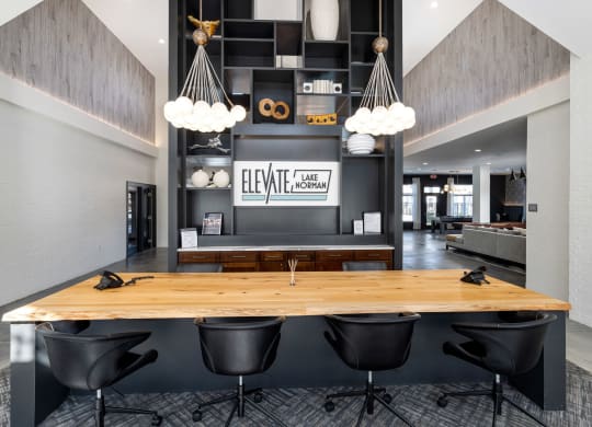 clubhouse entrance with a wooden table and black chairs