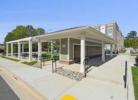 A covered walkway leads to a building with the number 1001 on it.