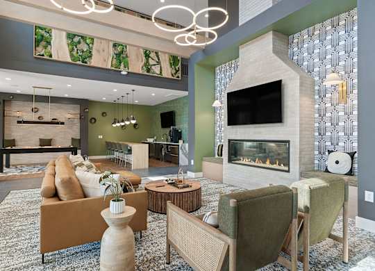 A modern living room with a fireplace and a TV.