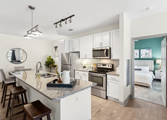 a kitchen with stainless steel appliances and a granite counter top
