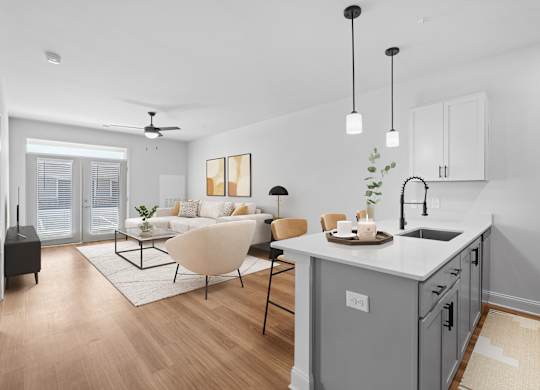 A modern kitchen with a dining table and chairs.