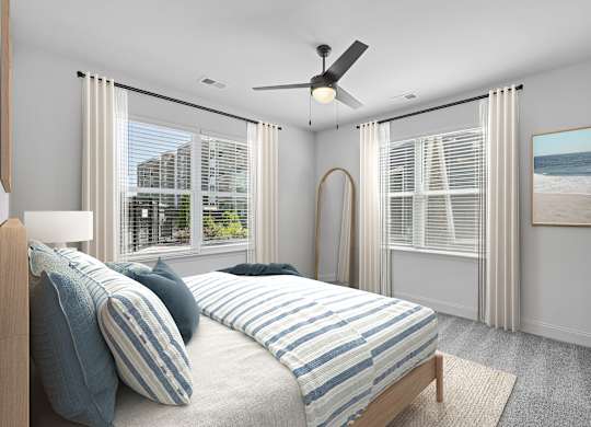 A bedroom with a large bed and a view of the beach.