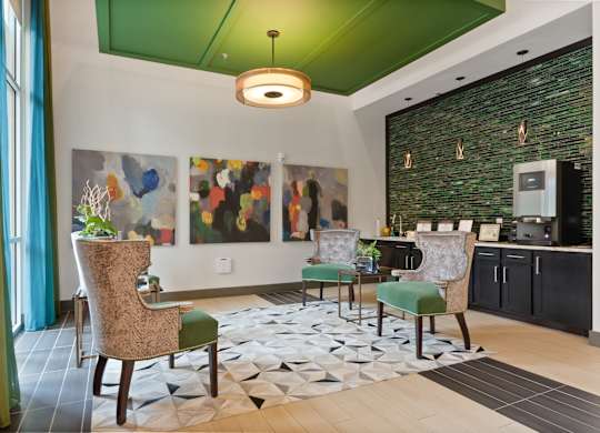 a living room with a green ceiling and a table with chairs