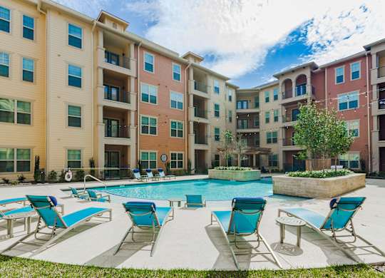 our apartments have a large pool and lounge chairs