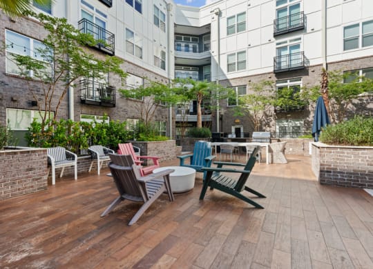 an outdoor patio with chairs and tables on a