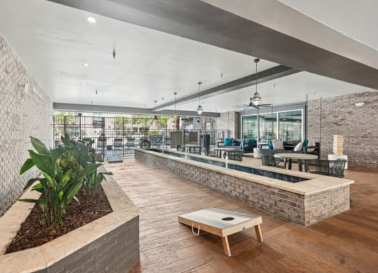 the lobby of a building with a reception desk and a seating area