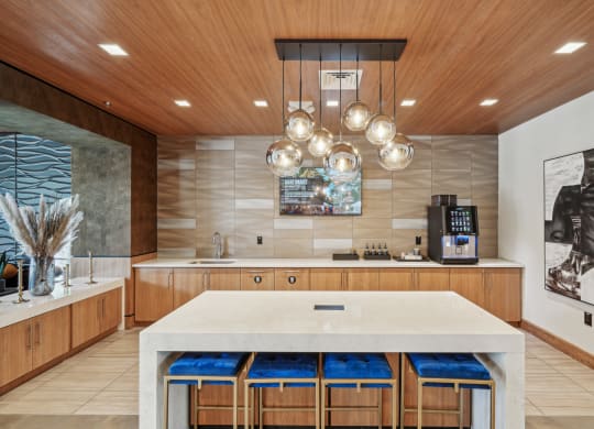 a large kitchen with a marble counter top and wooden cabinets