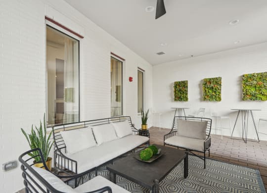 a living room with a couch and two chairs