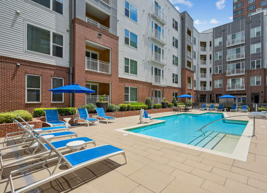 our apartments offer a swimming pool with chairs and umbrellas