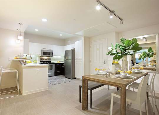 Open dining area and modern kitchen at Casa Mira View Apartments, California, 92126