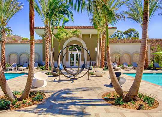 Courtyard with modern sculpture and arched architecture at Casa Mira View Apartments, California