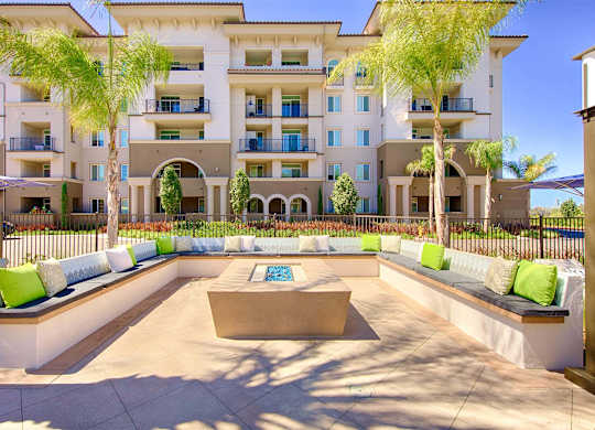 Outdoor fire pit lounge with built in seating at Casa Mira View Apartments, San Diego, CA 92126