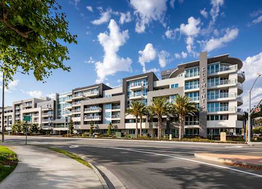 Modern apartment buildings with curved balconies at Elements Apartments, Irvine