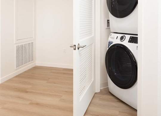 Stacked washer and dryer in closet at Elements Apartments, California, 92612
