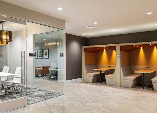 Private meeting booths with integrated task lighting at Elements Apartments, Irvine