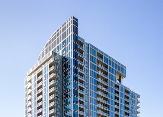 Modern high rise apartment building exterior at LUX by Garden* Apartments, San Diego, 92122