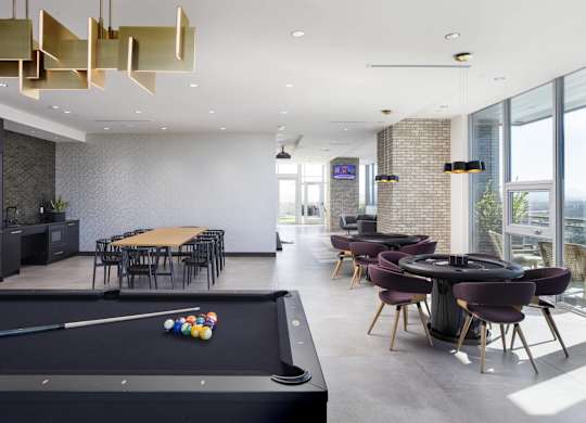 Community lounge with billiards and dining area at LUX by Garden* Apartments, San Diego, 92122