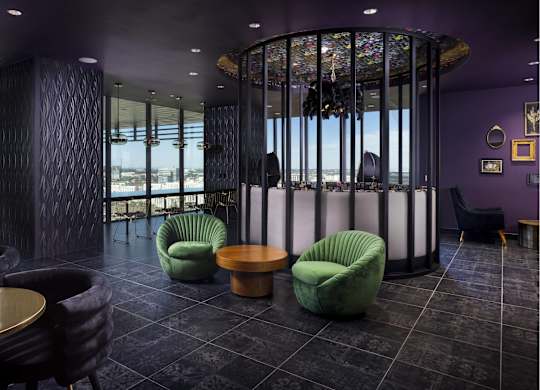 Luxury lounge with circular glass meeting space at LUX by Garden* Apartments, San Diego, 92122
