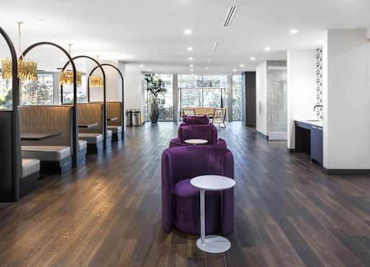Lobby with semi private booths and purple velvet chairs at LUX by Garden* Apartments, San Diego, 92122