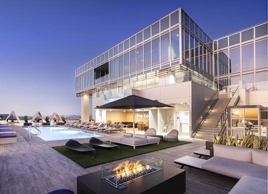 Rooftop pool deck with fire pit and modern lounge seating at LUX by Garden* Apartments, San Diego, 92122
