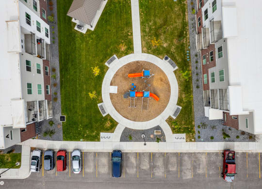 a birdseye view of a park with a circular seating area