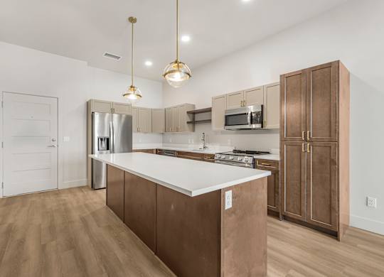 A kitchen with brown cabinets and a white countertop.
