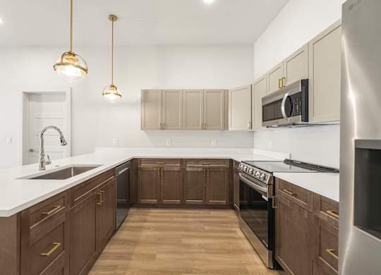 A kitchen with wooden cabinets and a white countertop.
