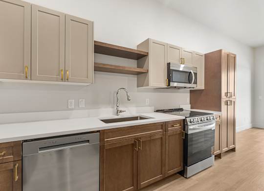 A kitchen with a stainless steel dishwasher and oven.