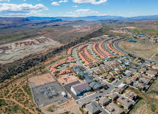 an aerial view of a community with houses and a road