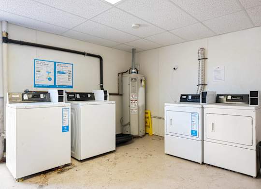 A room with white appliances and a white ceiling.