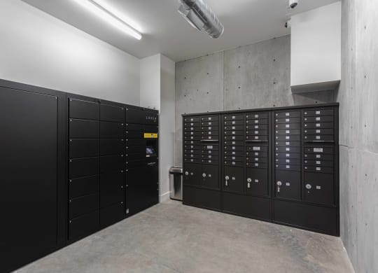 a bunch of black lockers in a room