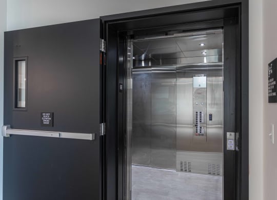 the door to the elevator in the lobby of a building