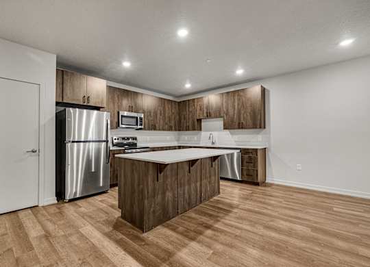 A kitchen with wooden cabinets and a white countertop.
