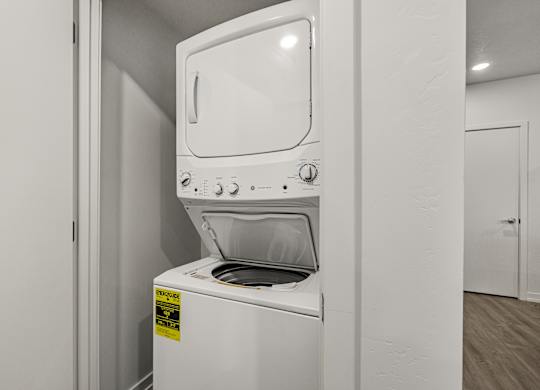 A white oven with a sticker on it.