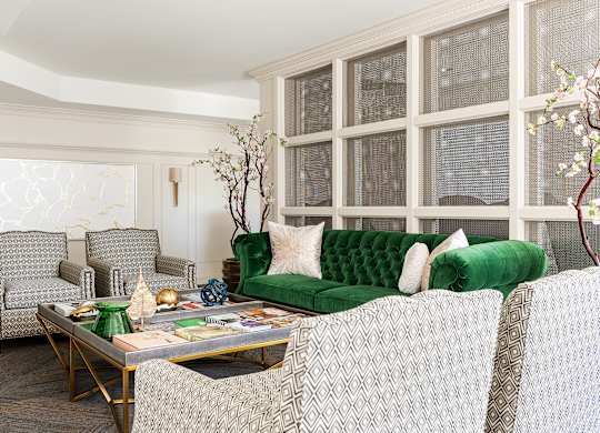 A living room with a green couch and a coffee table.