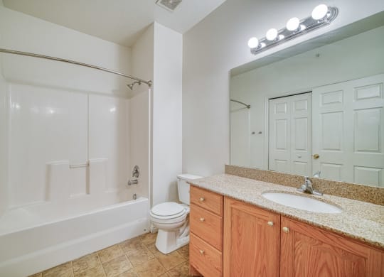 a bathroom with a toilet sink and bathtub