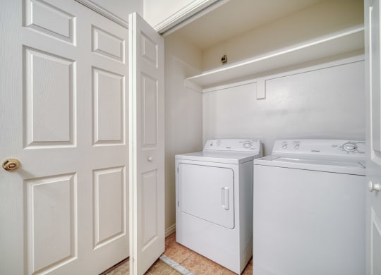 a laundry room with a washer and dryer