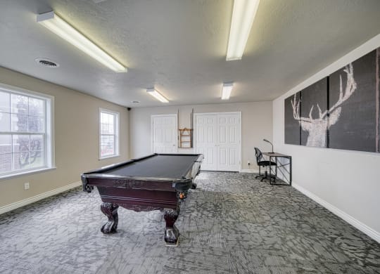 a spacious game room with a pool table