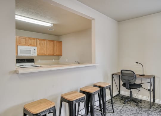 a room with a small table and four stools