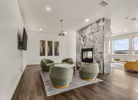 A living room with a fireplace and a television.