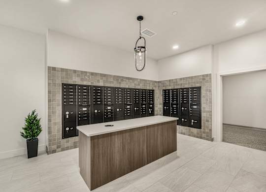 A reception area with a wooden counter and a wall of black panels.