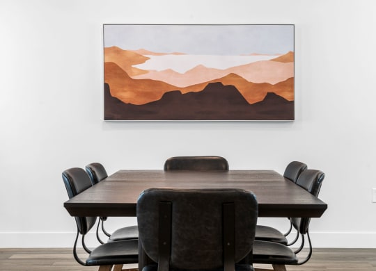 a painting of a conference room with a table and chairs